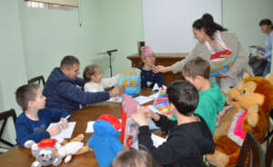 Damiana Hands Out Folders