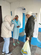 Angela & Valerii Give Aliona Water & TB Medicine