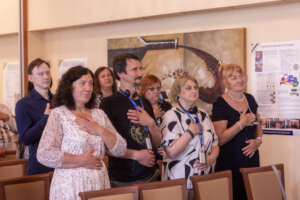Attendees Practice Breathing Exercises
