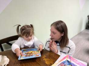 Little Nadejda Makes Puzzle with Maria
