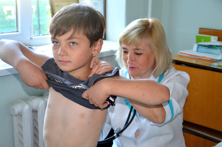 Dr. Elena listens to his lungs