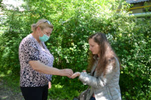 Angela Gives Olesia TB Drugs