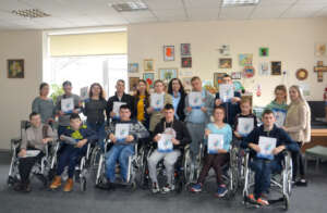 Margarita (center back) Presents Book in Riscani
