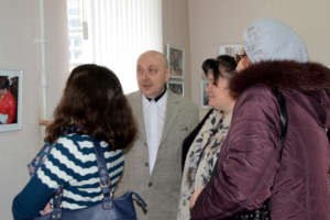 Alexandr and Visitors at Exhibition