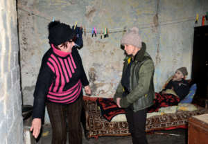 Galina checks Sergei & Liudmila's stove