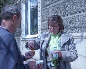 Nadejda giving TB drugs to Iurii
