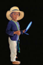 A child engaged in dress-up play.