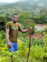 Donis surveys the tree nursery that he has built