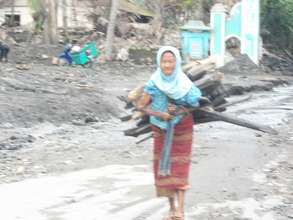Aminah looking for firewood to be sold again