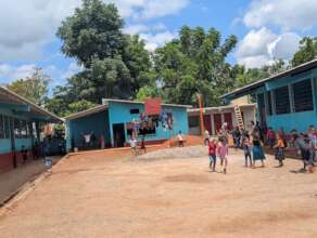 The schoolyard with the new bathrooms in the rear