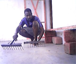 David Prepares Hoes for the Sibunimba Garden