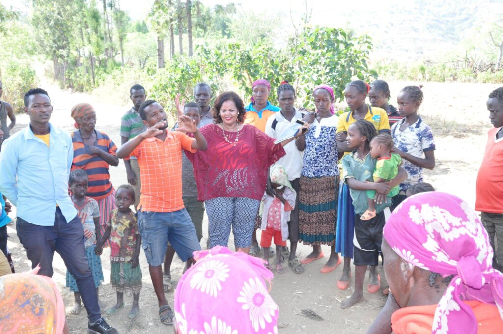 MHO Executive Director with beneficiarie in area