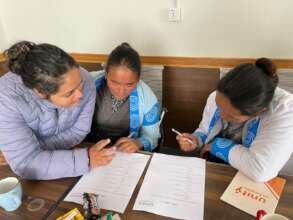Praja working with the female community volunteers