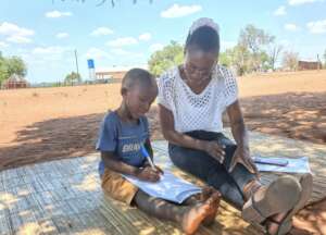 A child answers questions on an IDELA evaluation.