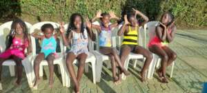 children being taken through swimming