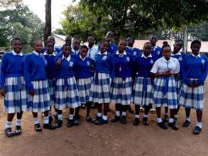 Students looking smart in newly donated uniforms.