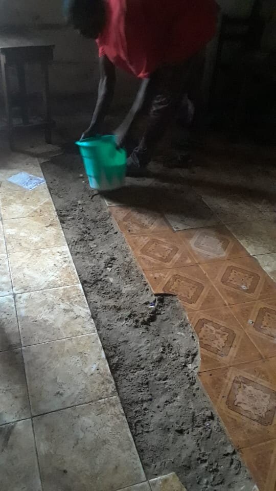 Filling the floor port hole in school.