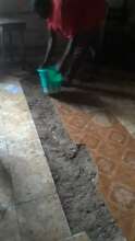 Filling the floor port hole in school.