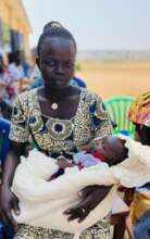Women with baby wainting to Doctor Ewa