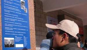 A Man Views an "Advisement of Rights" Poster
