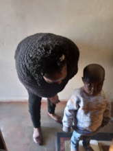 A toddler undergoing a routine health check-up