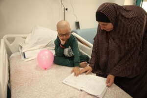 A little patient playing with his mum at Beit Jala