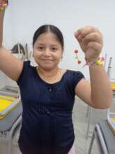 Sara is happy after finishing her artistic earring