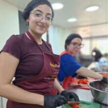Nour volunteering at our community kitchen
