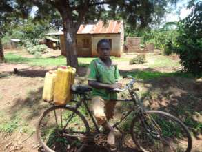 Tomasi the proud beneficiary of Global Giving