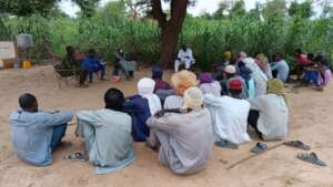 DIMA staff interview village weavers