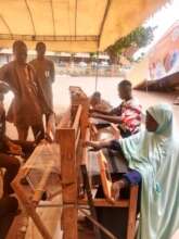 DIMA students demonstrate handweaving at stadium
