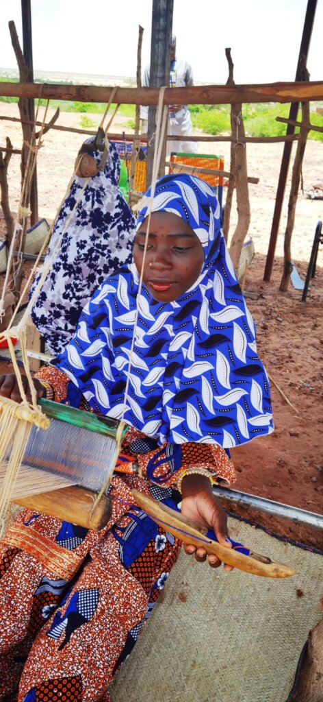 Learning to weave at our school in Kirubbe Keyna