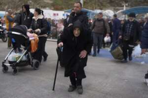 Older and Babies flee the island of Santorini