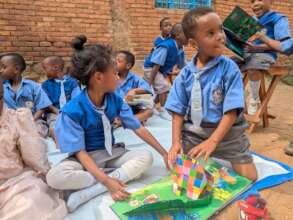 Elementary school students leaf through a children