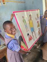 A happy pupil being interactive in a class lesson