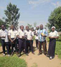 students getting pens and pencils
