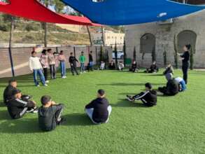 One of our psycho-social trainers with children