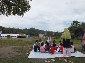 School children holding classes in open ground