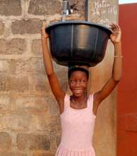 Getting drinking water for the family.