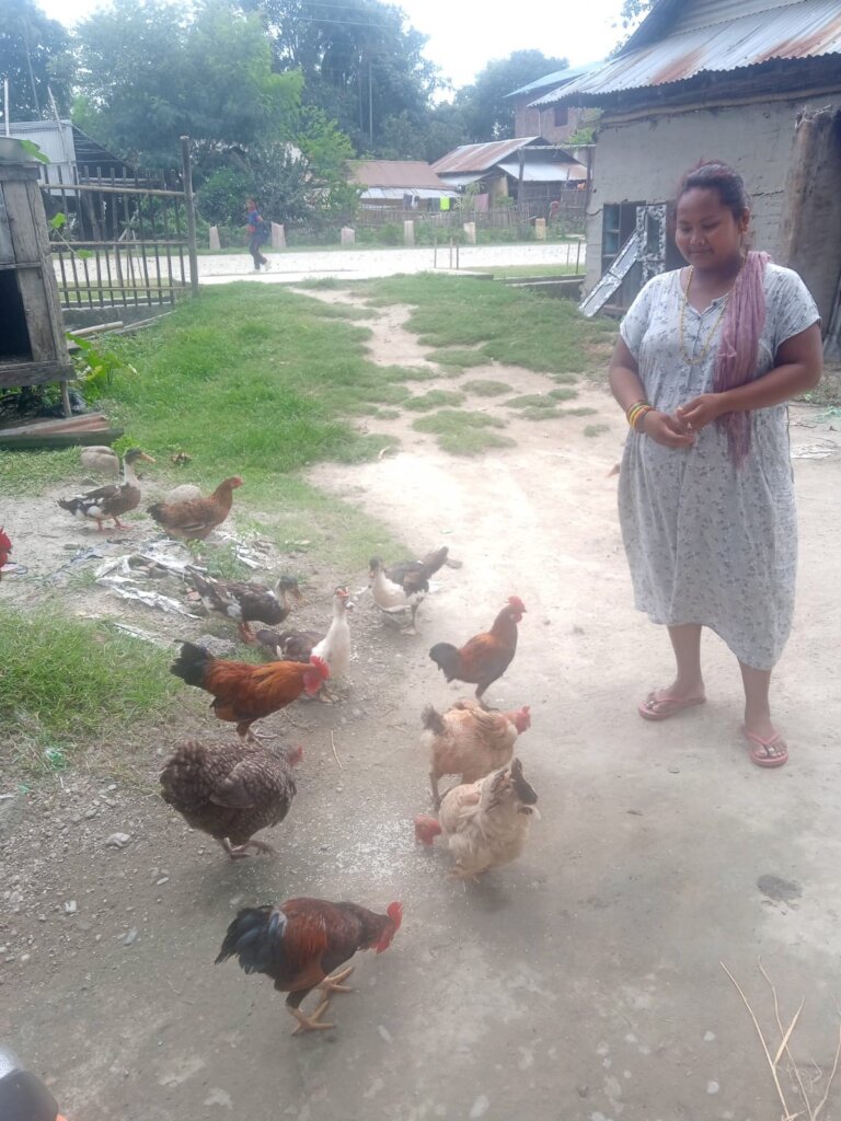 ETC's women's group member and her flock