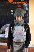 Vilma modeling the hat and scarf she just knitted.