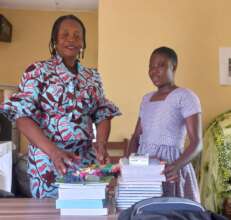 Gloria receives her school supplies.