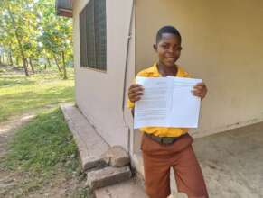 Lambert holds a letter from his sponsor.