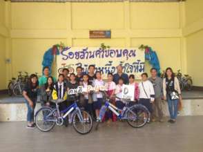 Students receiving their bikes from D-Land