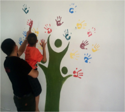 A student decorating the tree