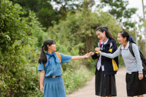 Students talking in the village