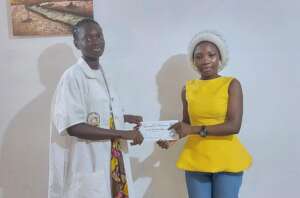 Rita receiving her fund.