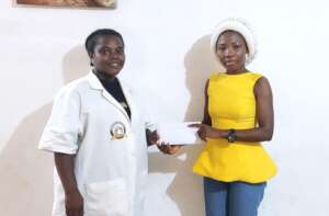Mercy receiving her fund.