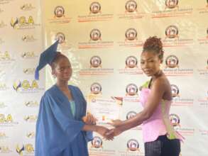 Patience receiving her certificate of completion.