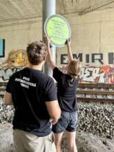 Putting up our signs on the rails
